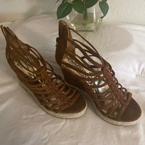 Carlos by Carlos Santana brown colored wedges.